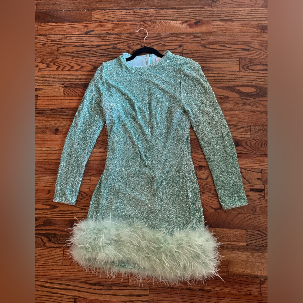 Mint sequence high neck feather hem mini dress with long sleeves! CLUB L LONDON